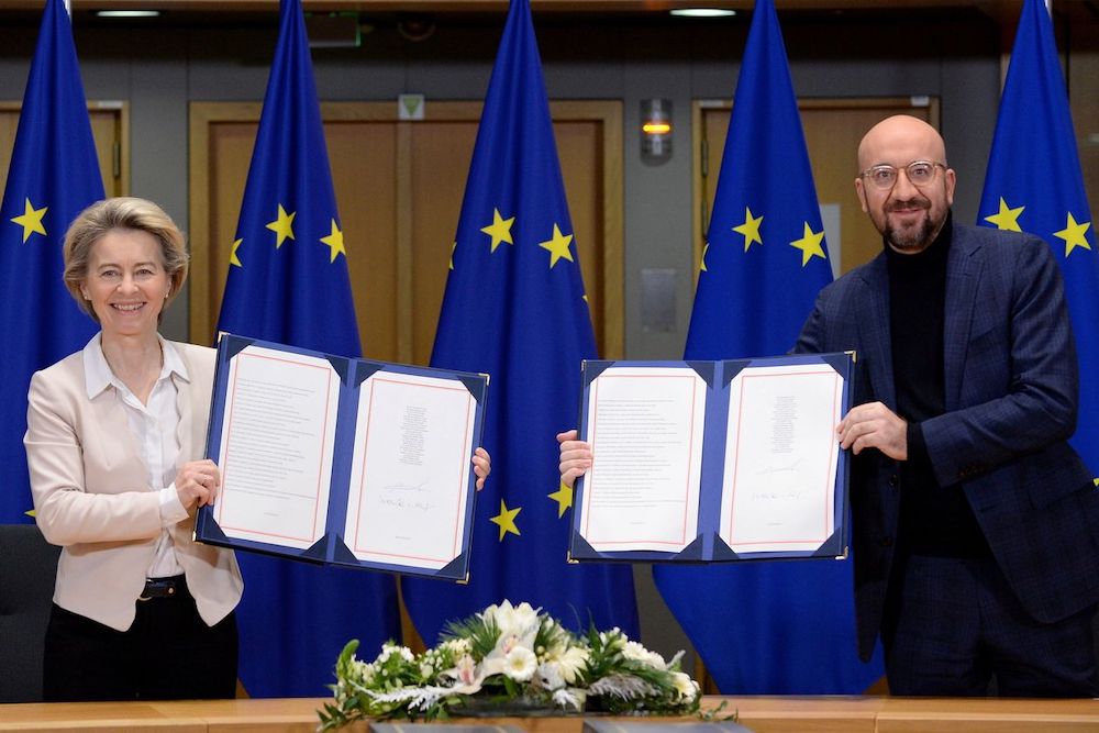 European Commission President Ursula von der Leyen and European Council President Charles Michel the signed trade pact Wednesday in Brussels