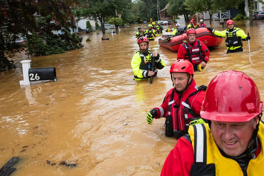 henri-Members of the New Market Volunteer Fire Company searched during a flash-flood evacuation effort Sunday in Helmetta