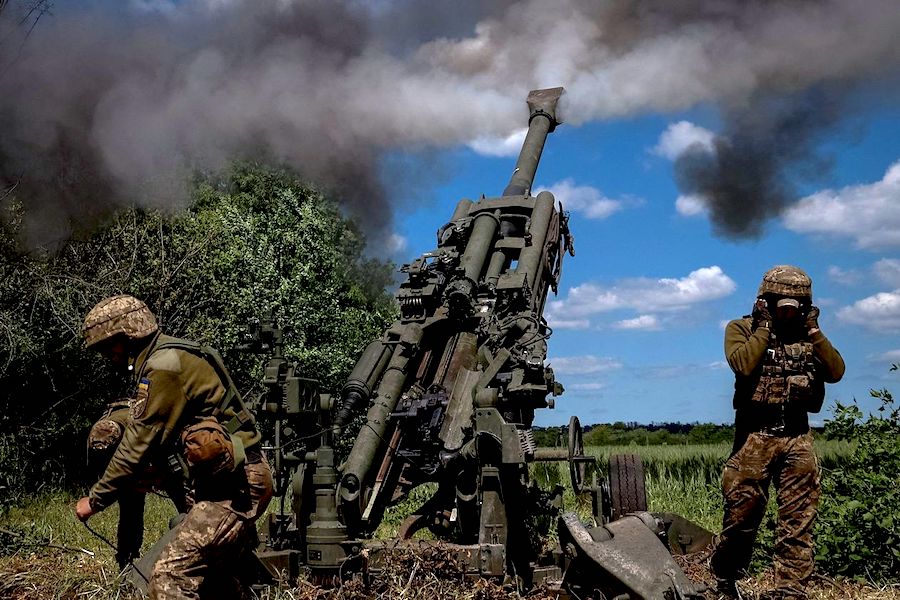 Ukrainian service members fired an M777 howitzer in June