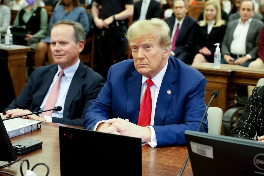 Former president Donald J. Trump, flanked by his lawyer Christopher M. Kise