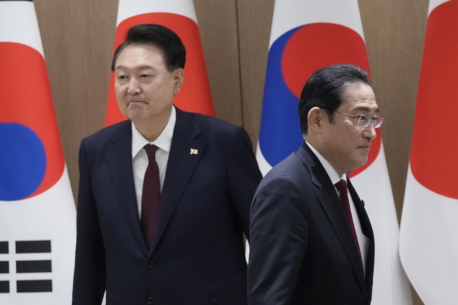 South Korean President Yoon Suk Yeol, left, and Japanese Prime Minister Fumio Kishida
